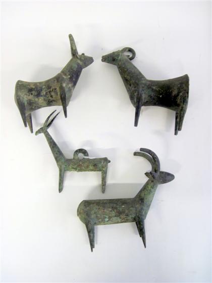 Appraisal: Group of Near Eastern bronze figures of ibexEach with hollow