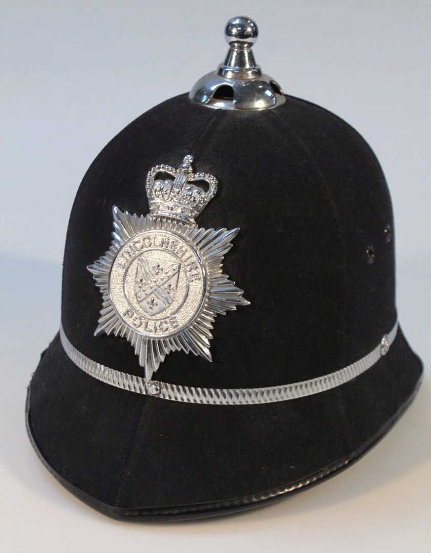 Appraisal: A NATO style police helmet with Lincolnshire badge and part