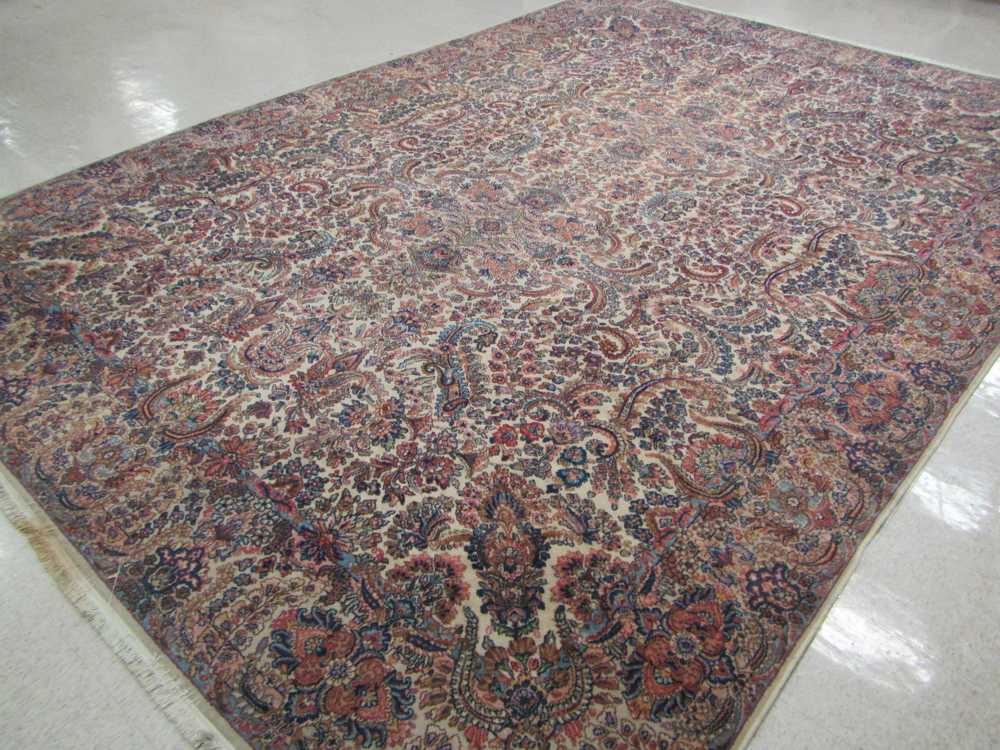 Appraisal: A KARASTAN AMERICAN ORIENTAL CARPET Kerman floral pattern on cream