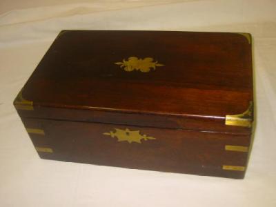 Appraisal: A ROSEWOOD AND BRASS BOUND WRITING SLOPE of oblong form