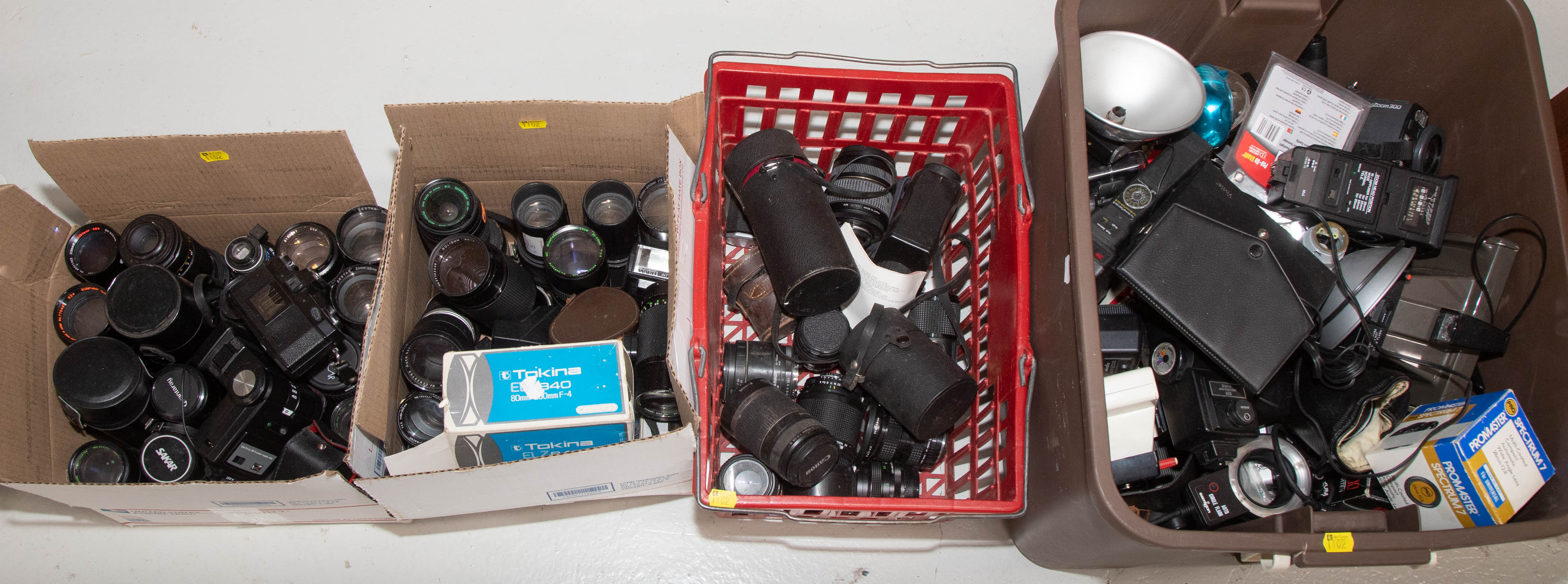 Appraisal: FOUR BOXES OF ASSORTED CAMERA PARTS Including cameras lenses flashes