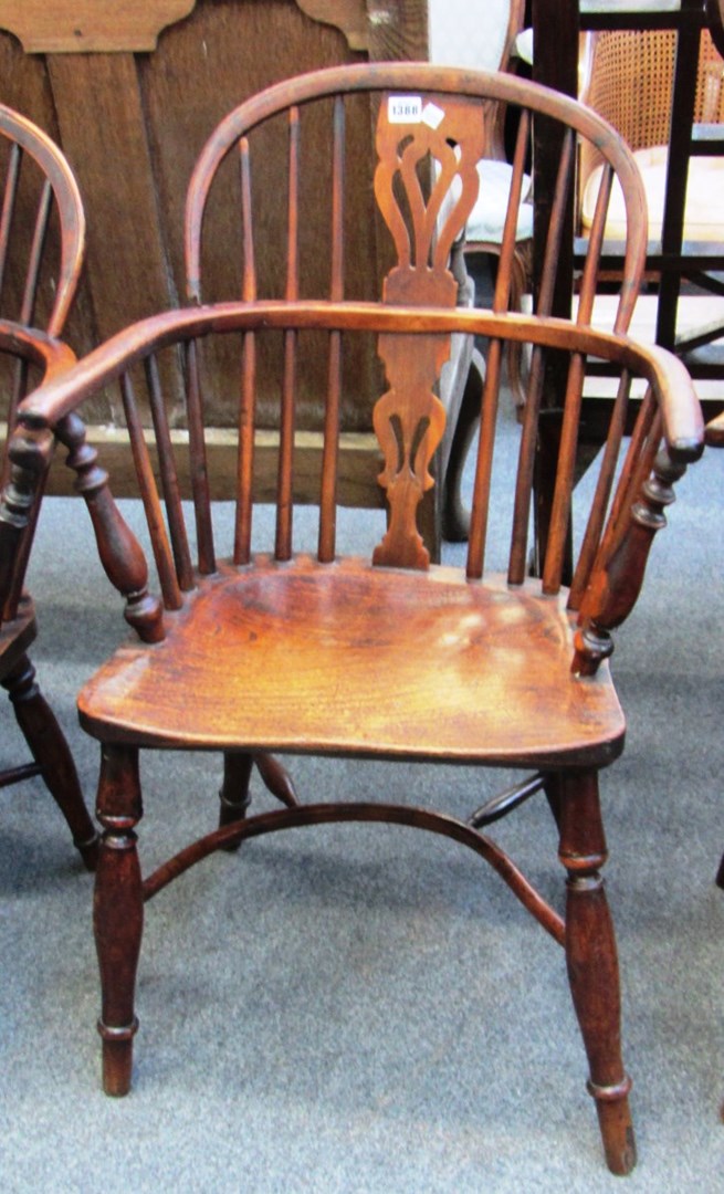 Appraisal: A George III elm and yew bow back Windsor chair