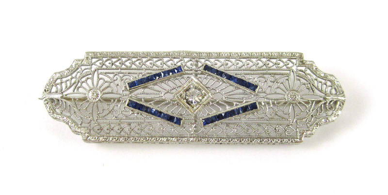 Appraisal: ESTATE SAPPHIRE AND WHITE GOLD ART DECO PIN The filigree