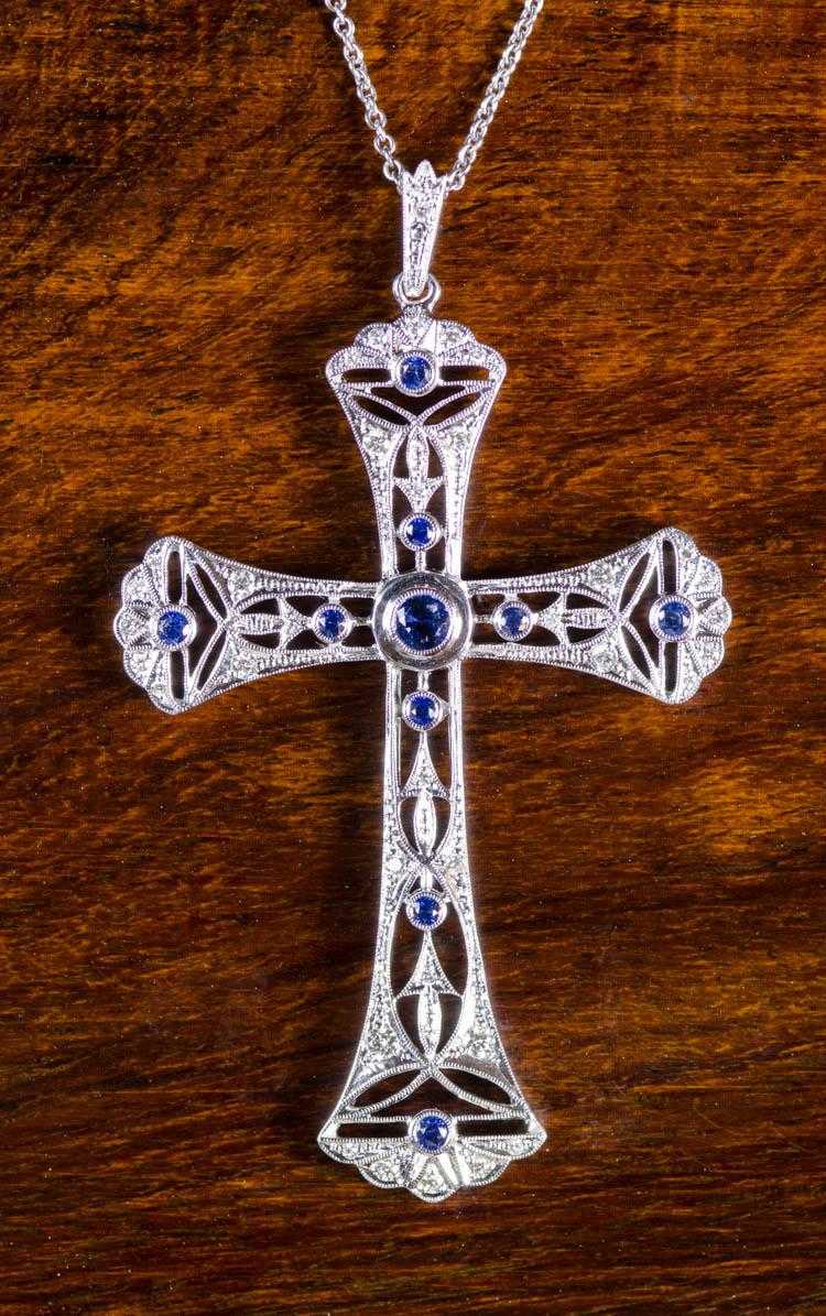 Appraisal: SAPPHIRE AND DIAMOND CROSS PENDANT NECKLACE suspended on an inch