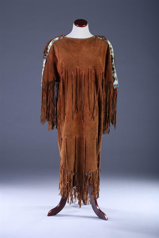 Appraisal: NATIVE AMERICAN BUCKSKIN DRESS mid- th century Beaded fringe on