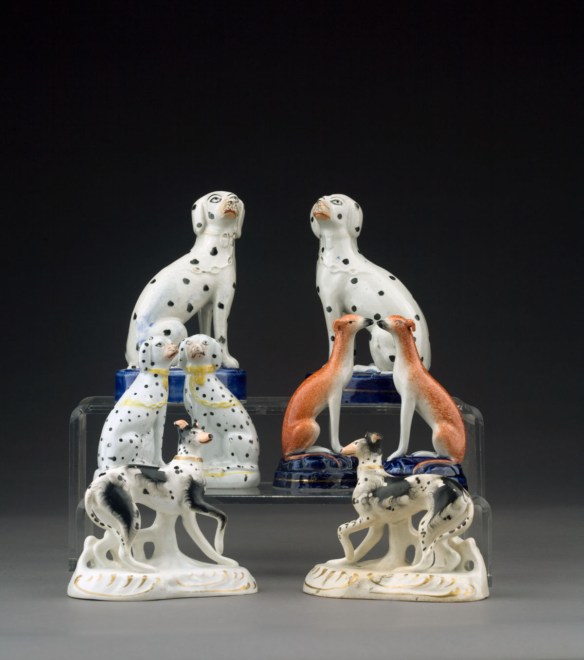 Appraisal: GROUP OF STAFFORDSHIRE POTTERY AND PORCELAIN FIGURES OF DOGS MID-LATE