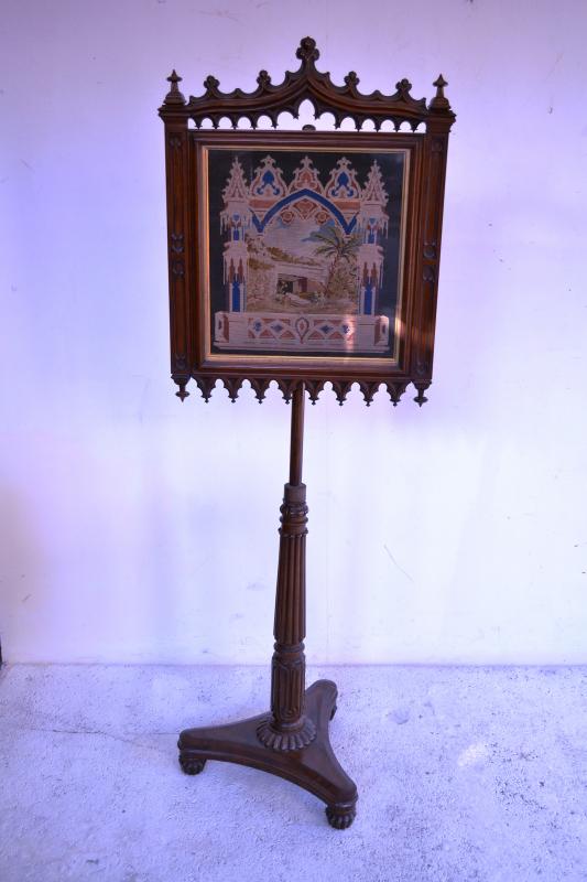 Appraisal: A TH CENTURY GOTHIC REVIVAL ROSEWOOD FIRESCREEN ON CARVED STAND