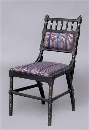 Appraisal: EBONIZED REFORM GOTHIC SIDECHAIR The spindled top rail with incised