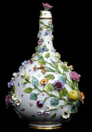 Appraisal: MEISSEN PORCELAIN FLORAL-ENCRUSTED BOTTLE VASE AND COVER With underglaze blue