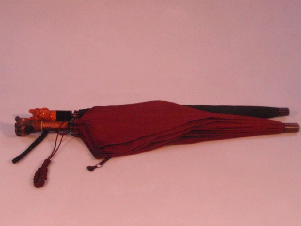 Appraisal: An early thC lady's umbrella the wooden handle carved as