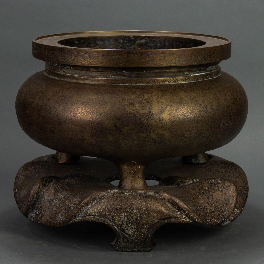 Appraisal: CHINESE BRONZE TRIPOD CENSER AND STAND Chinese bronze tripod censer