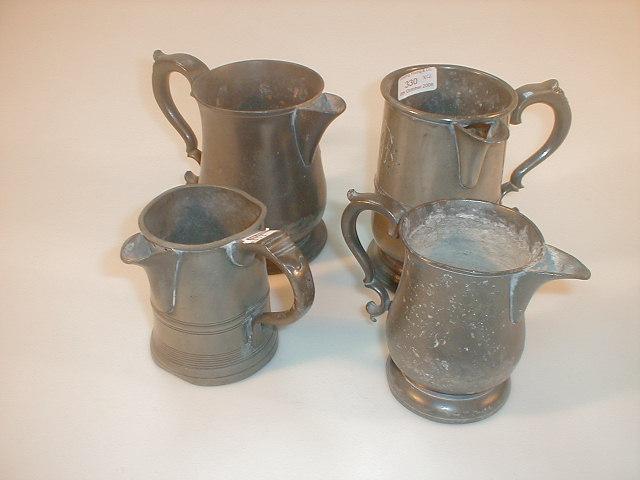 Appraisal: A Victorian quart pewter measure with pouring spout and double