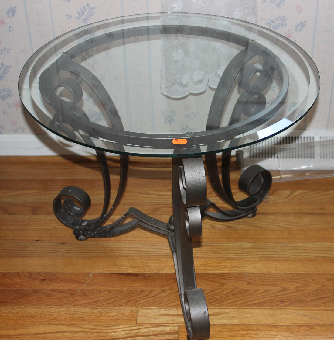 Appraisal: Wrought metal beveled glass top side table