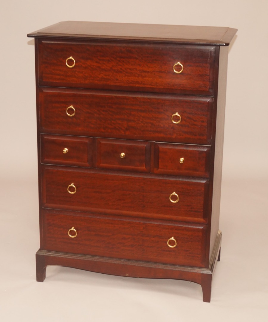 Appraisal: A Stag Minstrel mahogany chest of drawers with a moulded