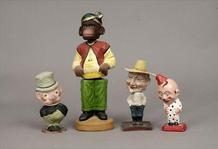 Appraisal: Four Papier-M ch Bobbing-Head Figures to in