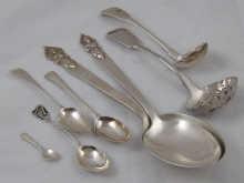 Appraisal: Silver a pierced fiddle pattern sauce ladle by John Walton