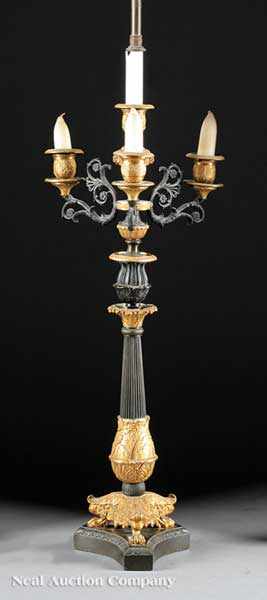 Appraisal: A French Empire Gilt and Patinated Bronze Four-Light Candelabrum th