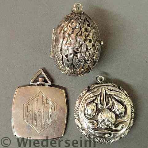 Appraisal: A sterling silver cushion shaped locket with monogram a sterling