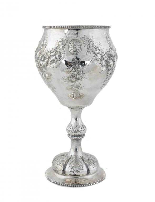 Appraisal: A VICTORIAN CUP the beaded ogee bowl embossed with swags