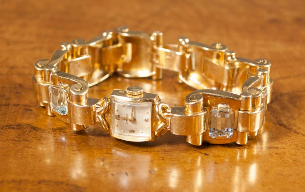 Appraisal: LADY'S SWISS OMEGA AQUAMARINE AND EIGHTEEN KARAT GOLD INTEGRAL BRACELET