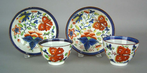 Appraisal: Two Gaudy Dutch cups and saucers th c in the