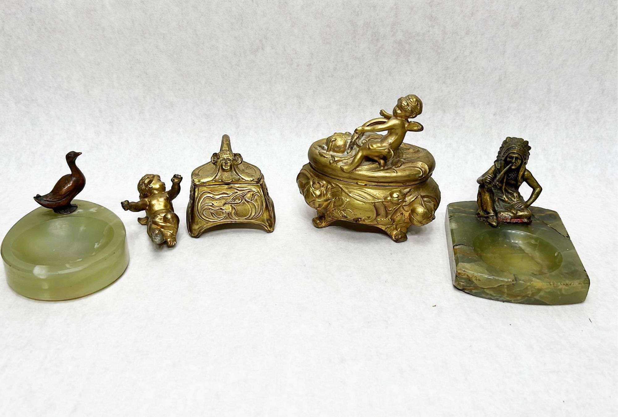 Appraisal: Lot Including Bronze Figural Ashtrays Gilt Metal Boxes Etc Condition