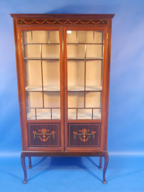 Appraisal: An Edwardian mahogany china cabinet with simulated marquetry decoration and