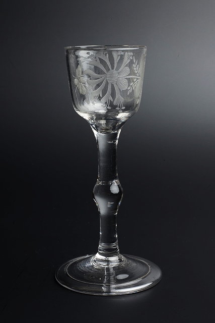 Appraisal: AN TH CENTURY WINE GLASS the bowl engraved with honeysuckle