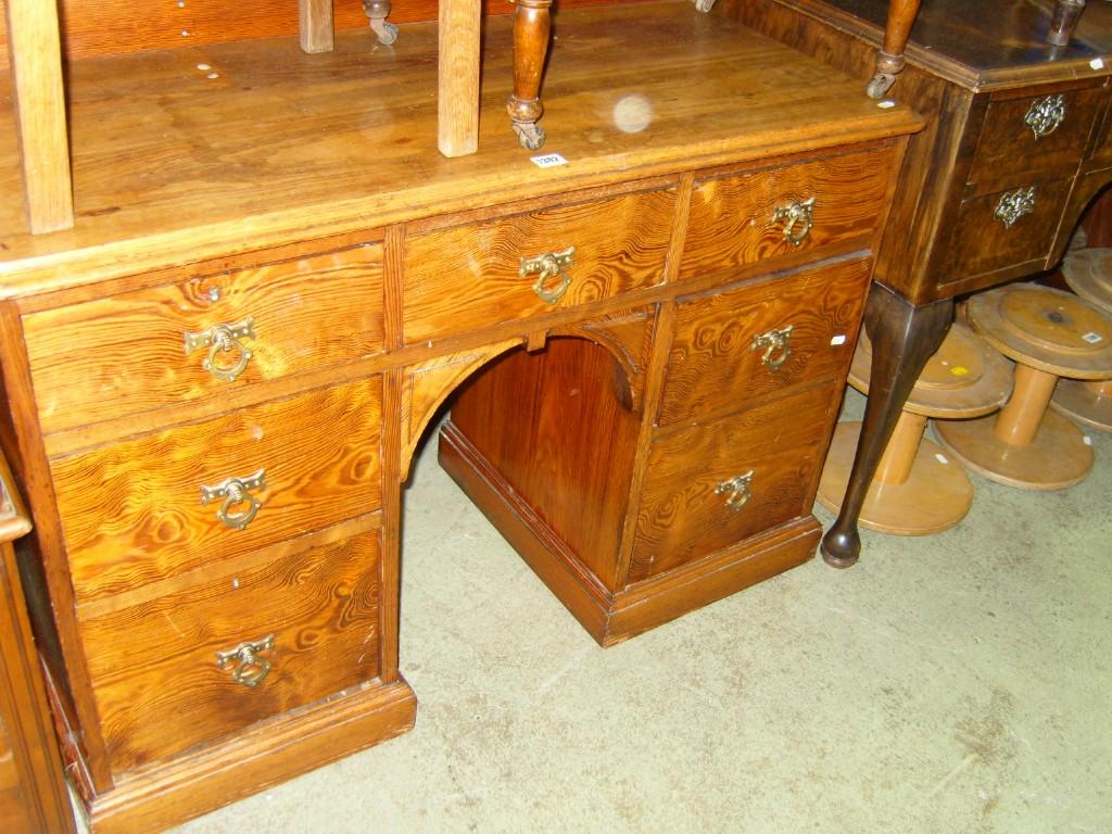 Appraisal: A Victorian pitch pine kneehole pedestal desk dressing table fitted