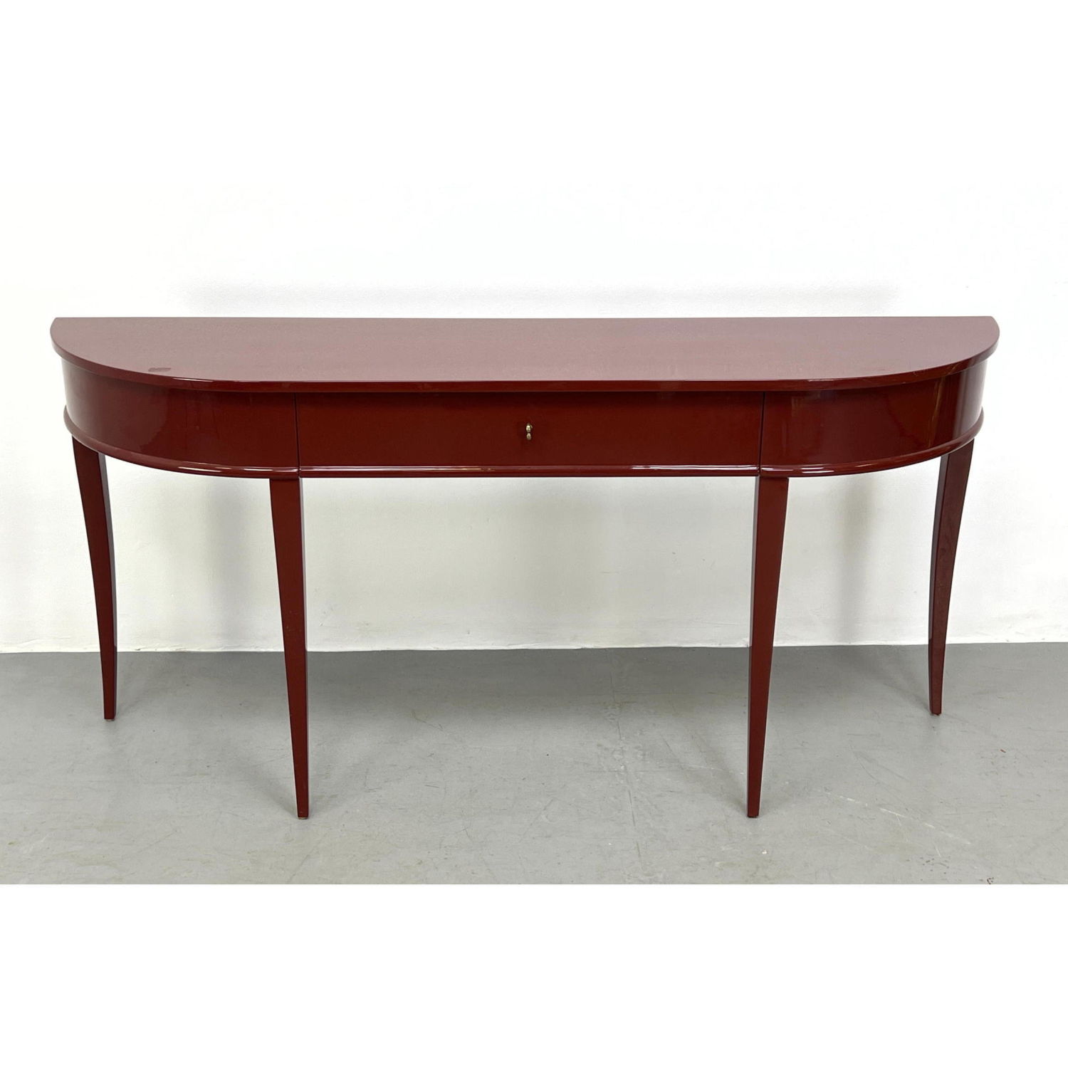 Appraisal: Burgundy Lacquered Demi Lune Hall Console Table Elegant tapered legs