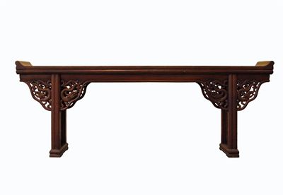 Appraisal: A Chinese elm wood altar table with upright scroll ends