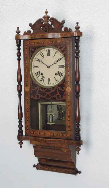 Appraisal: E N WELCH MARQUETRY INLAID WALL CLOCK Carved crest with