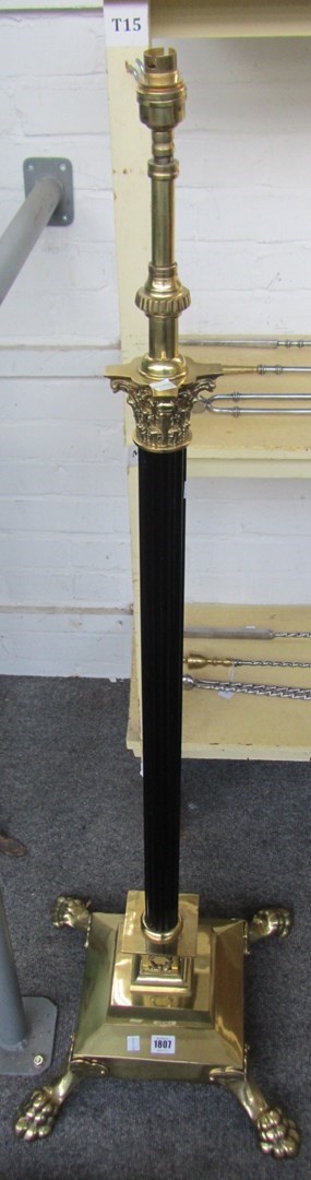 Appraisal: A black lacquer and brass Corinthian column telescopic standard lamp