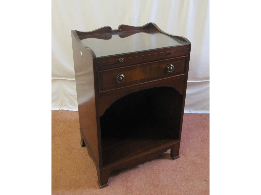 Appraisal: A Regency style mahogany cabinet the pull out writing slide