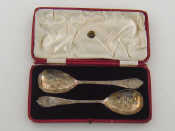 Appraisal: A pair of late Victorian silver fruit serving spoons the