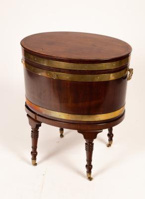 Appraisal: A Regency mahogany brass bound wine cooler with handles to