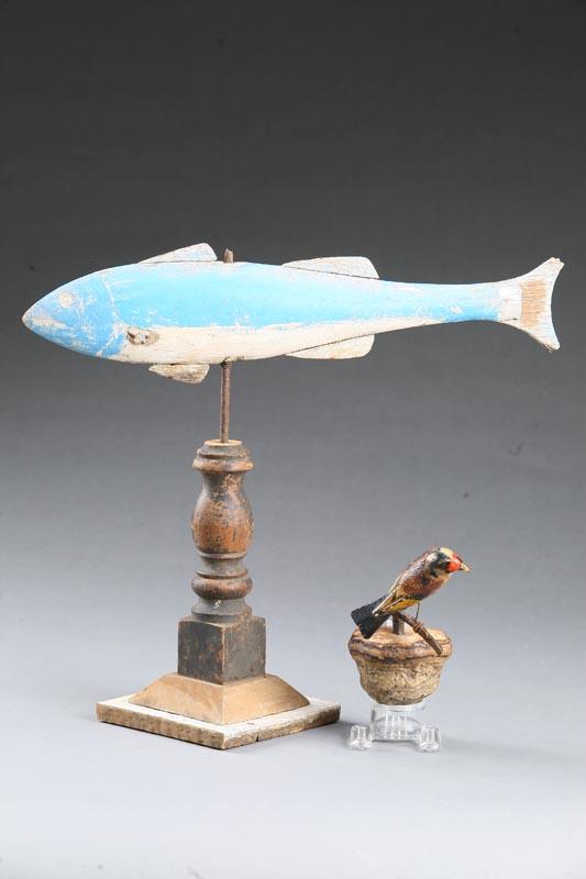 Appraisal: TWO FOLK ART CARVINGS American th century wood Fish on