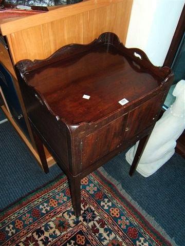 Appraisal: A Georgian mahogany pot cupboard on square legs wide x