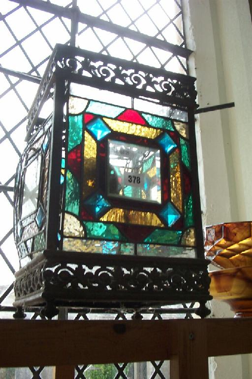 Appraisal: A Victorian -sided hanging hall lantern with coloured and leaded