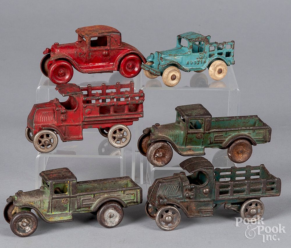 Appraisal: Six small cast iron vehicles Six small cast iron vehicles