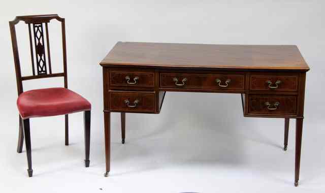 Appraisal: An Edwardian mahogany desk fitted five drawers around a kneehole