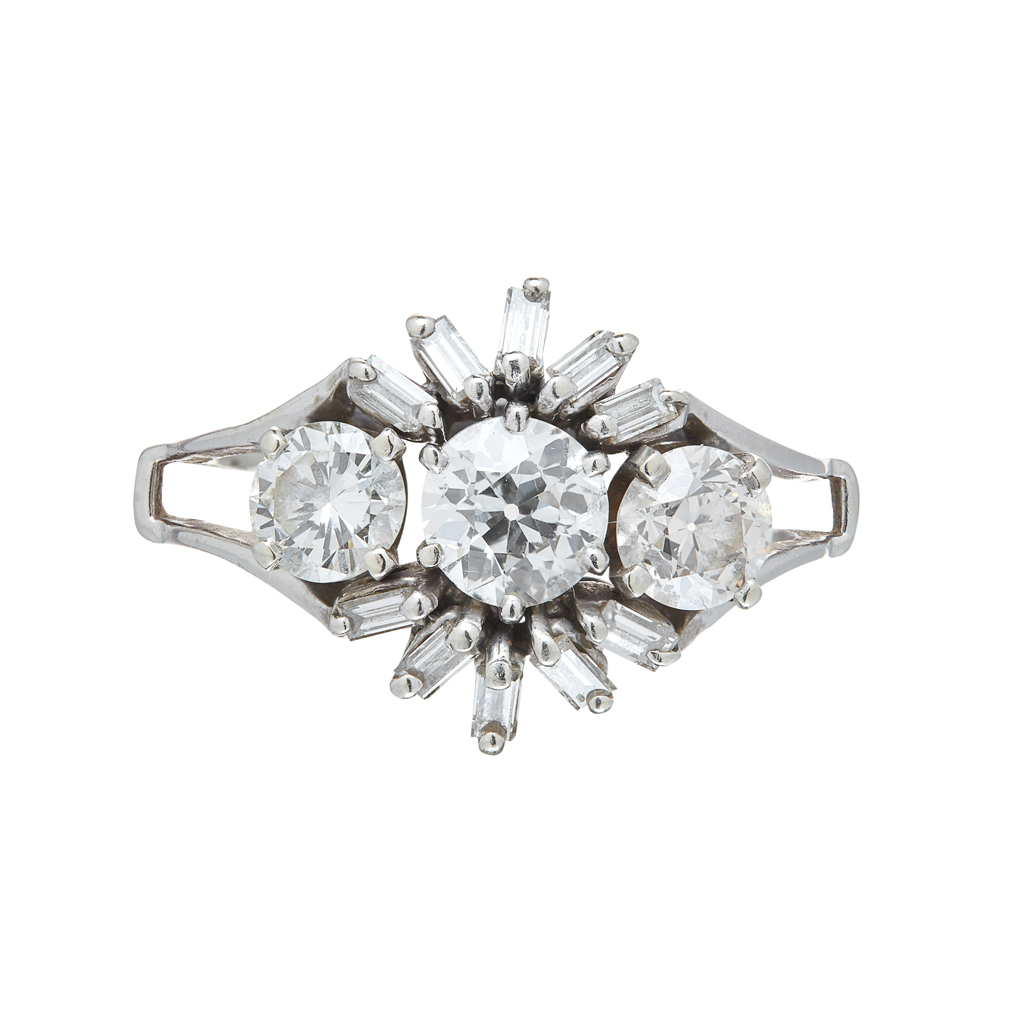 Appraisal: A diamond set cluster ring claw set with three graduated