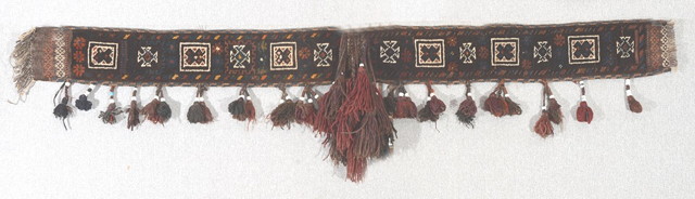 Appraisal: AN AFGHAN TRIBAL CAMEL DRESSING with attached tassels and geometric