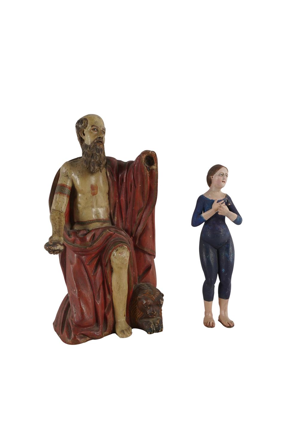 Appraisal: TWO CARVED PAINTED WOOD SANTOSCondition loss to hand of larger