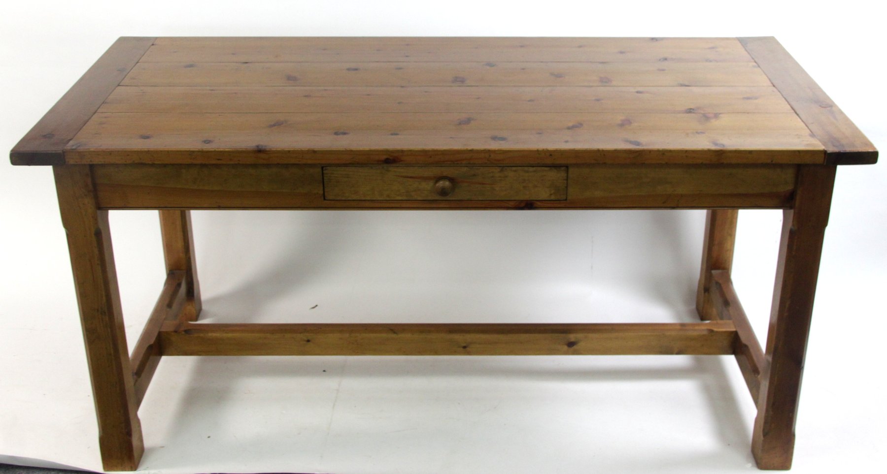 Appraisal: A pine kitchen table on square chamfered legs joined by