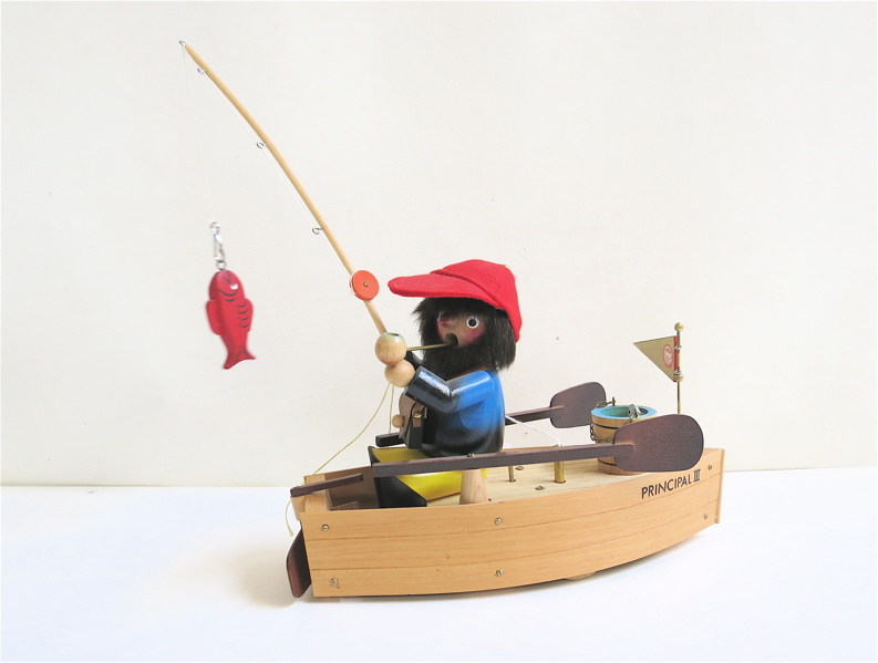 Appraisal: STEINBACH WOOD FIGURAL MUSIC BOX fisherman in boat wind-up music