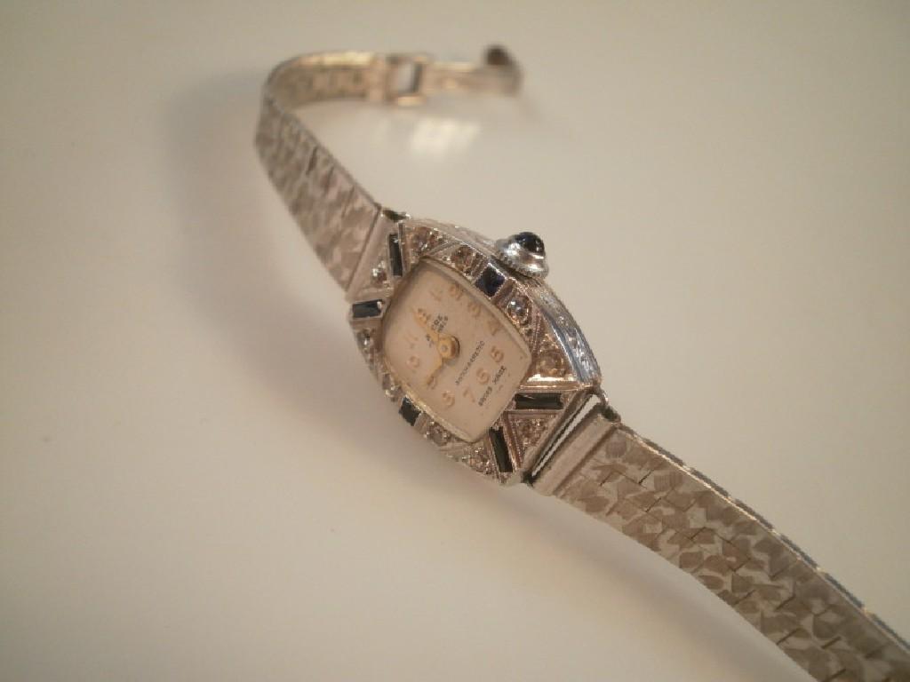 Appraisal: A white metal Art Deco cocktail watch by Ancre Swiss