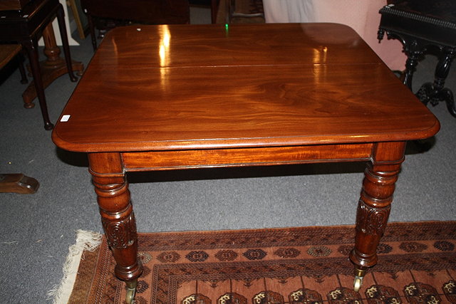 Appraisal: AN EARLY VICTORIAN MAHOGANY EXTENDING DINING TABLE having a rectangular