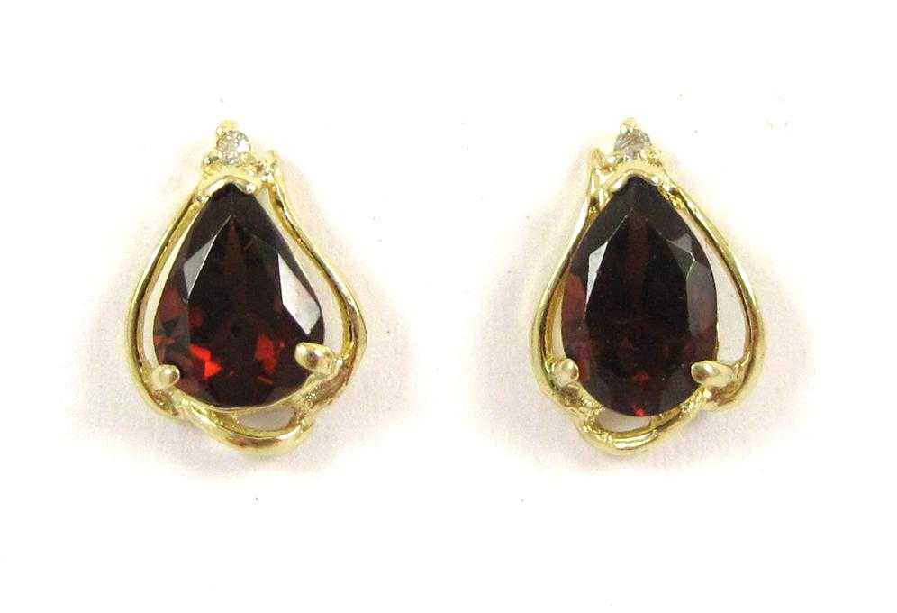 Appraisal: PAIR OF GARNET AND DIAMOND EARRINGS each k yellow gold