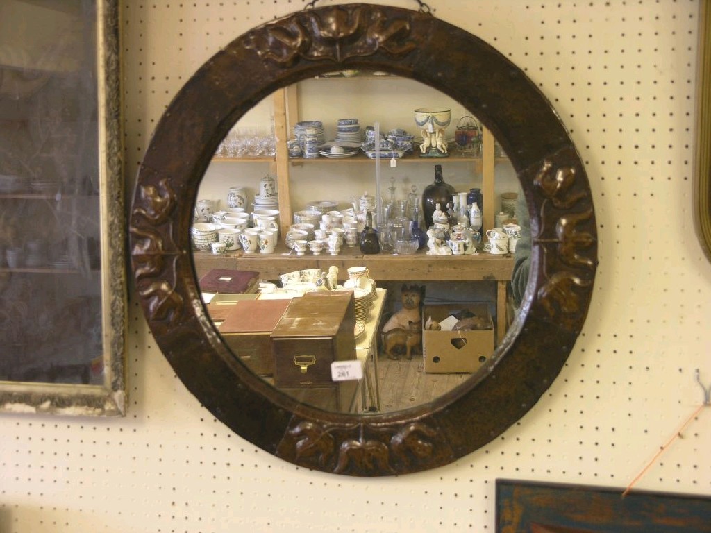 Appraisal: An Art Nouveau embossed copper mirror circular shape embossed with